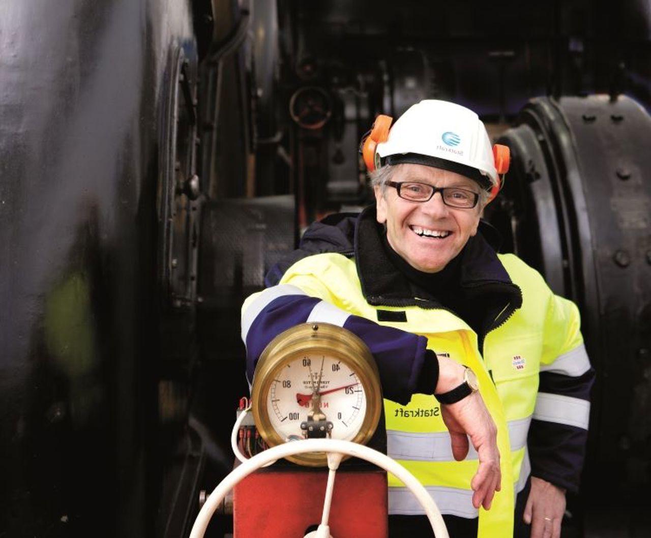 Smiling employee inside power plant